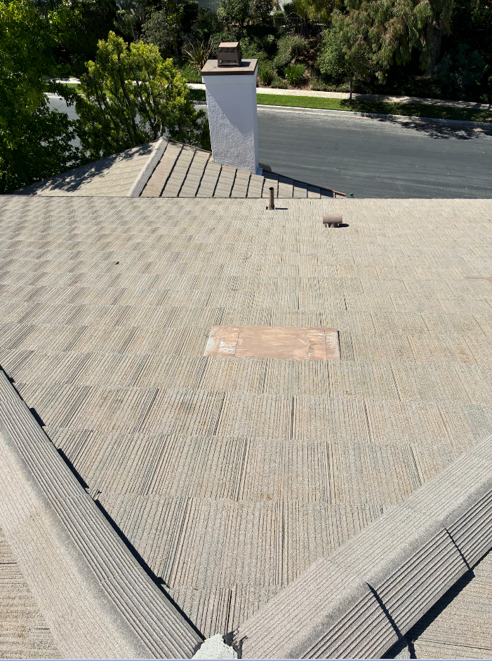 Soft-wash cleaning on shingle roof